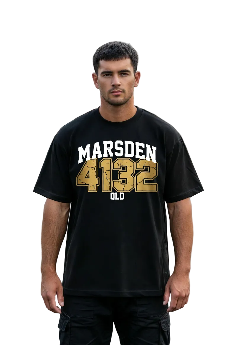Man wearing a black t-shirt with 'MARSDEN 4132 OLD' printed on it, standing on a residential street.