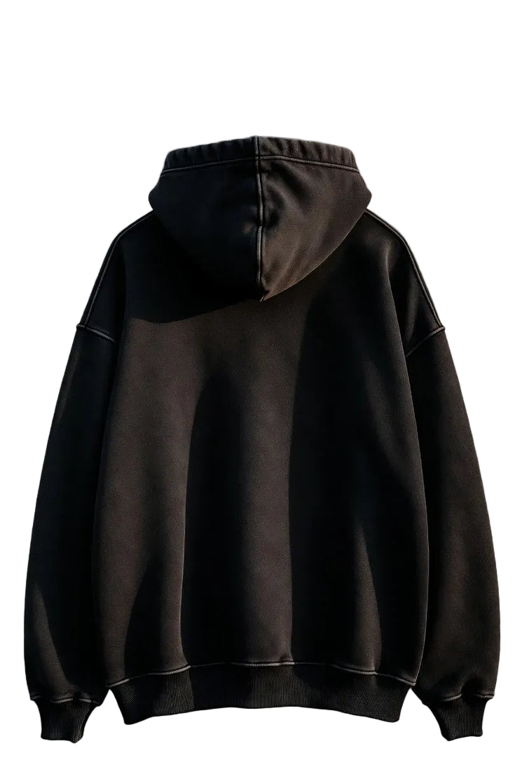 Black hoodie against a textured wall background