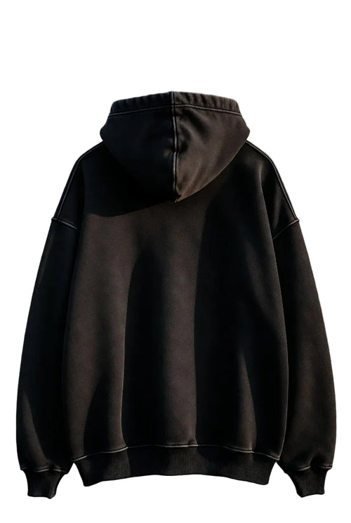 Black hoodie against a textured wall background